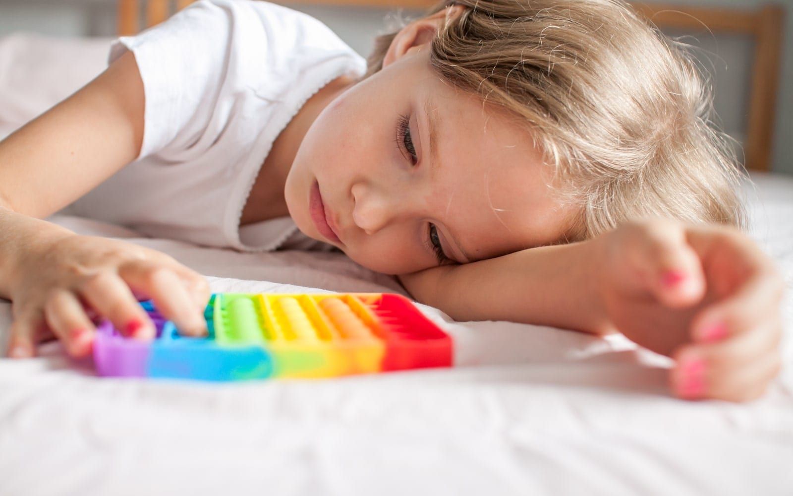 Child playing with anxiety soothing toy