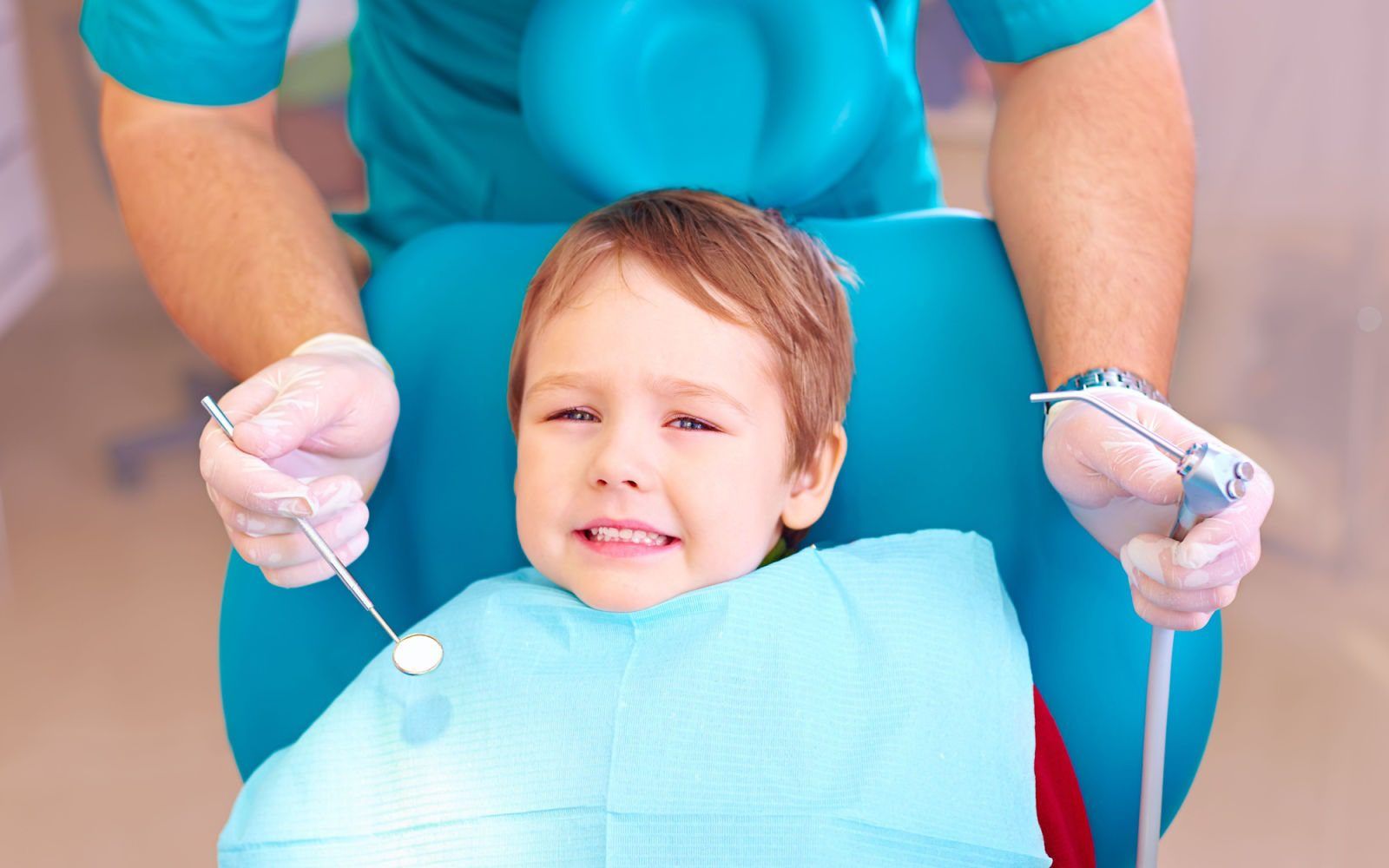 Child Feelijng Nervous in Dentist Office Chair