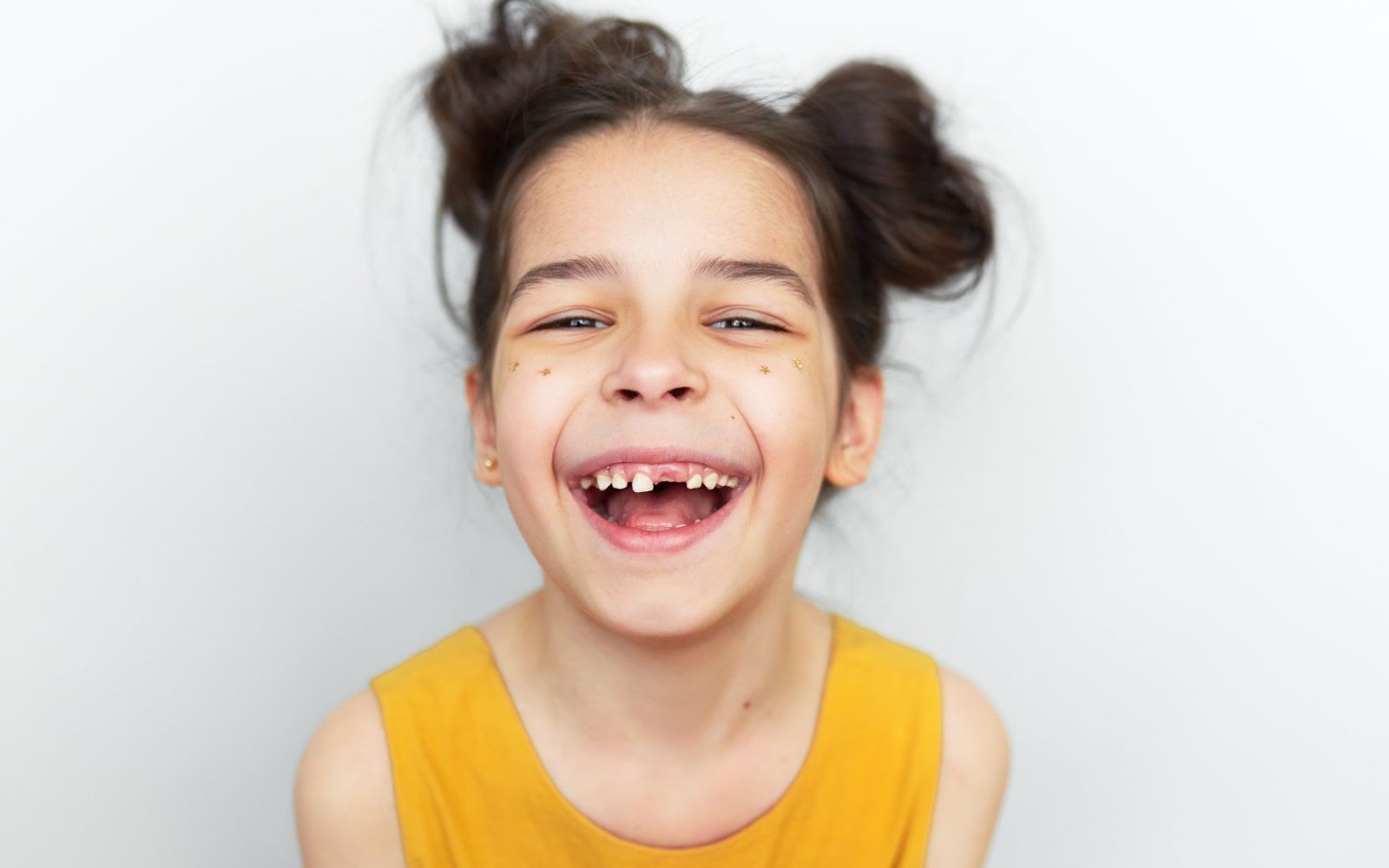 Child Smiling with Missing Teeth
