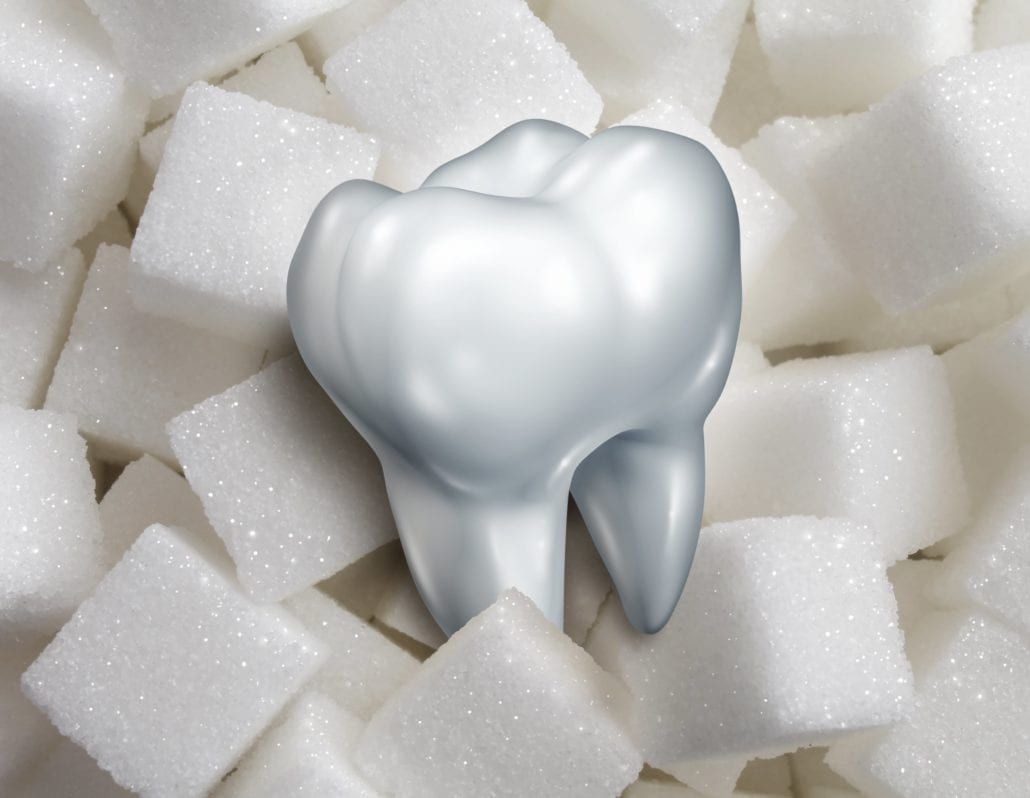 Tooth sitting atop sugar cubes