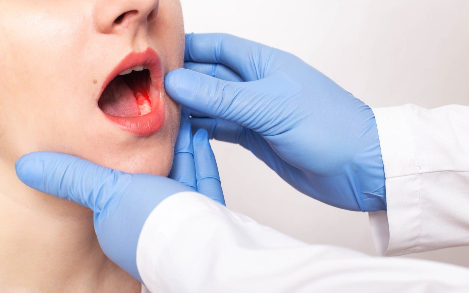 Woman getting her teeth examined