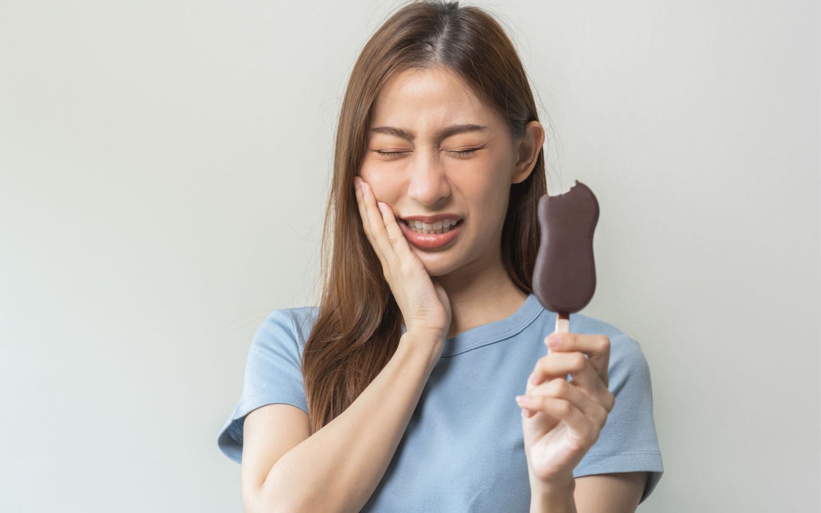 Woman with Sensitive Teeth After Eating Ice Cream