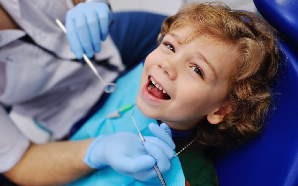 Child Smiling at Dentist Closeup