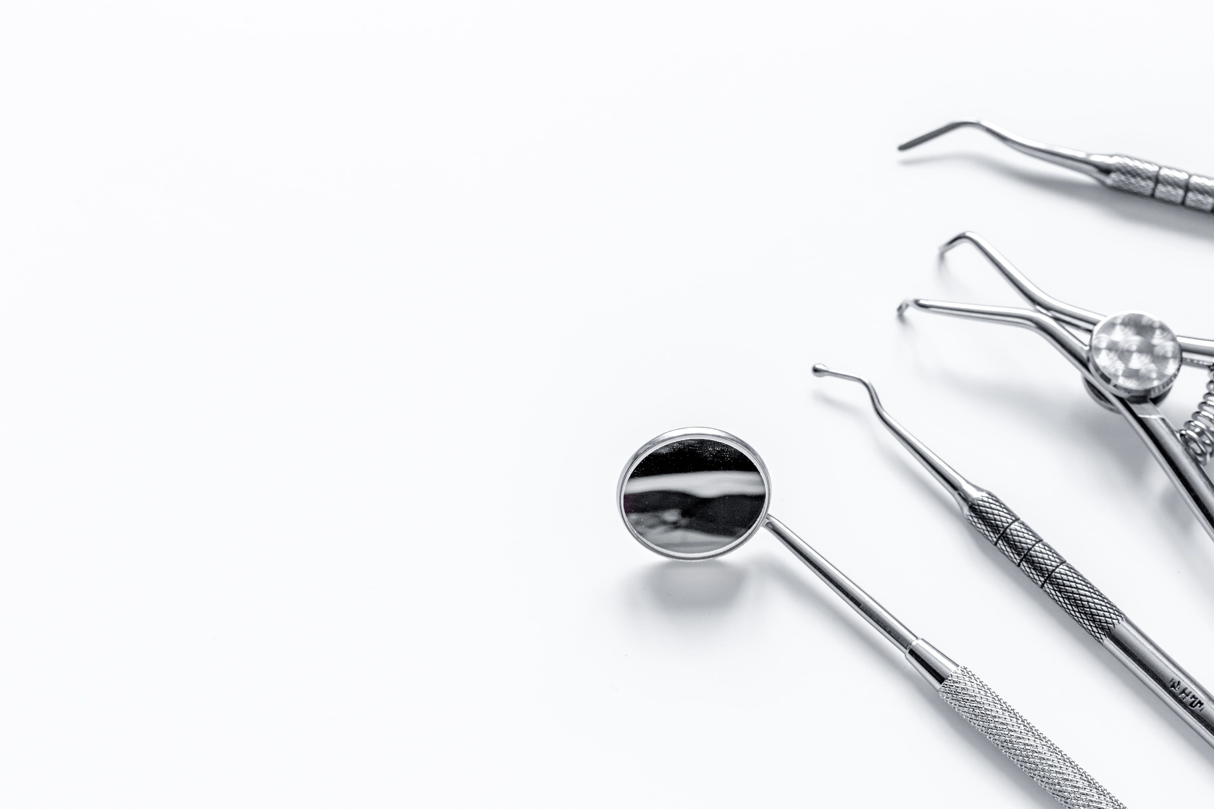 Various dental tools on a white background