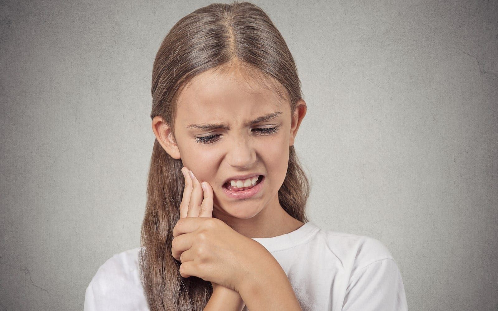 Young Girl Experiencing Sensitive Teeth