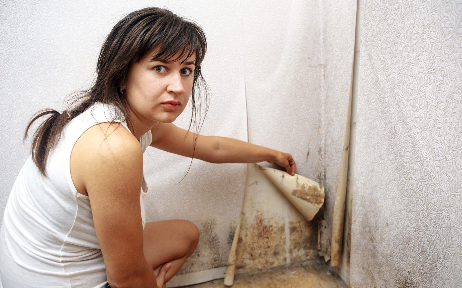 Woman pointing out Black Mold